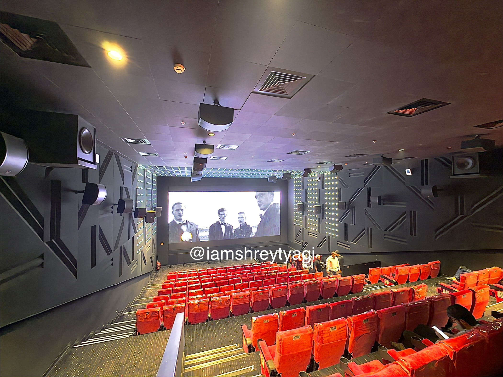 Ultra wide shot of screen and auditorium from the back